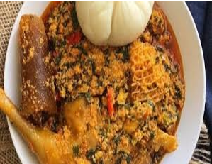 Poundo, Egusi soup served with Assorted, Pomo and Fish
