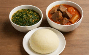 Poundo, served with Efo-Riro, Stew, Assorted/Smoked fish/Fish